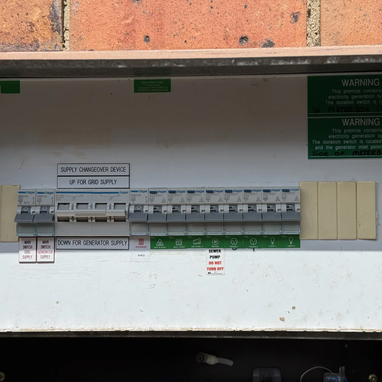 Older switchboard being assessed before a new appliance circuit is added