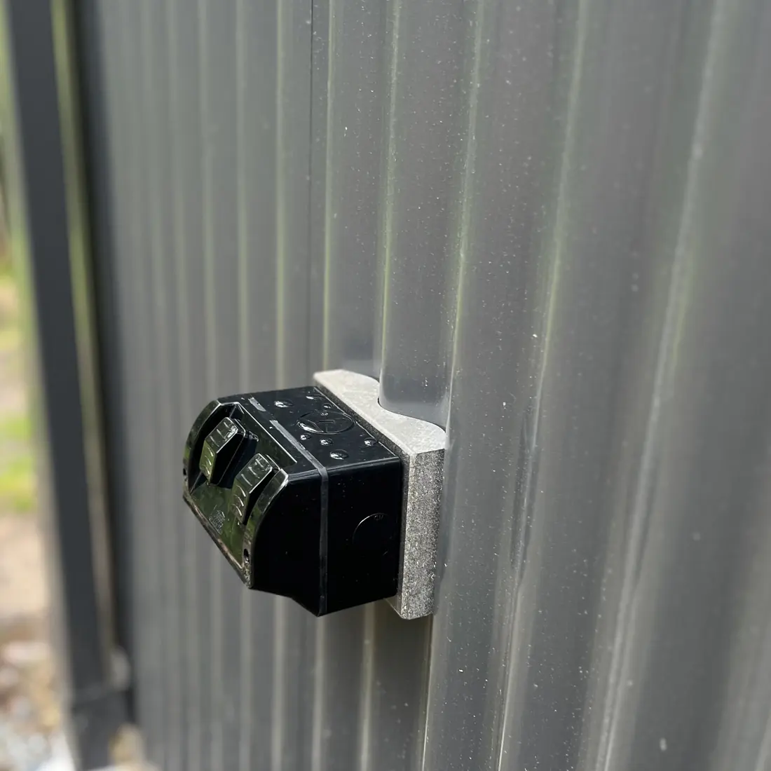 Sensor light installed on the exterior wall of a shed