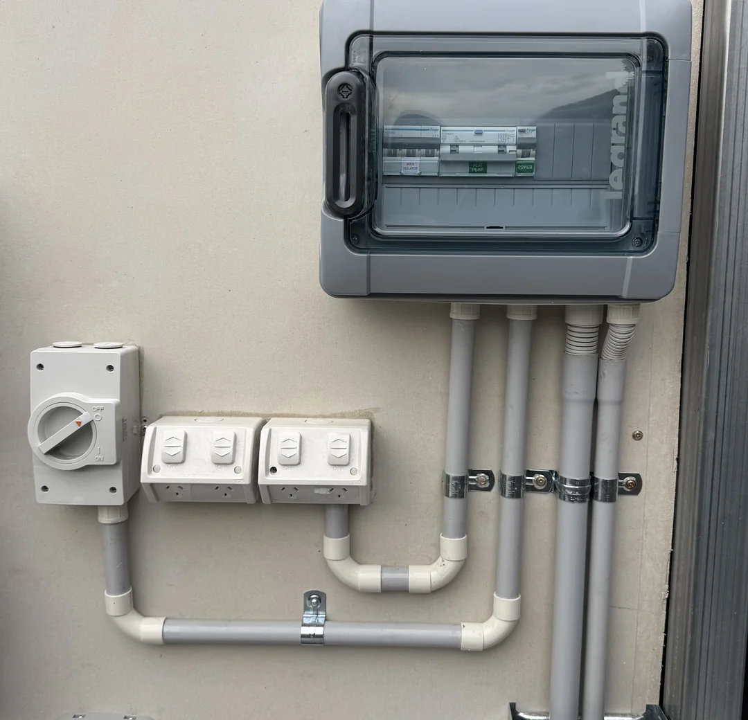 Weatherproof outdoor enclosure, isolator and powerpoints on an exterior wall